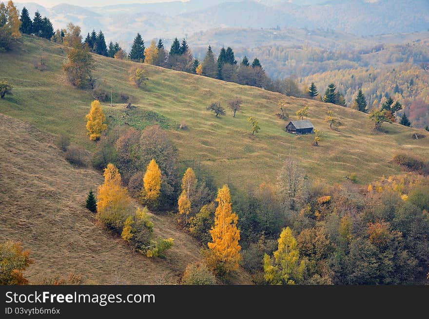 Mountain landscape with  wooden house