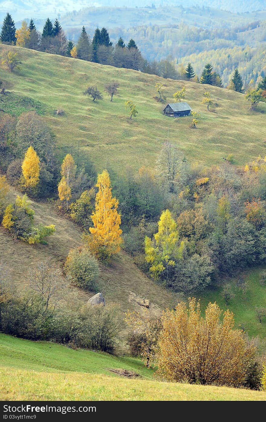 Wooden isolated cottage on autumn hill. Wooden isolated cottage on autumn hill