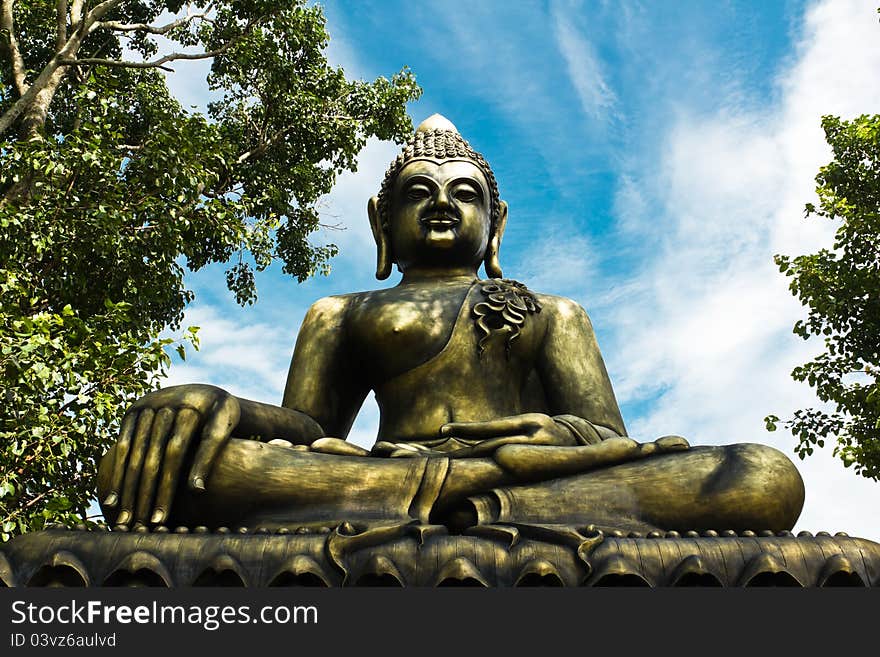 Buddha Statue Between The Bo Tree