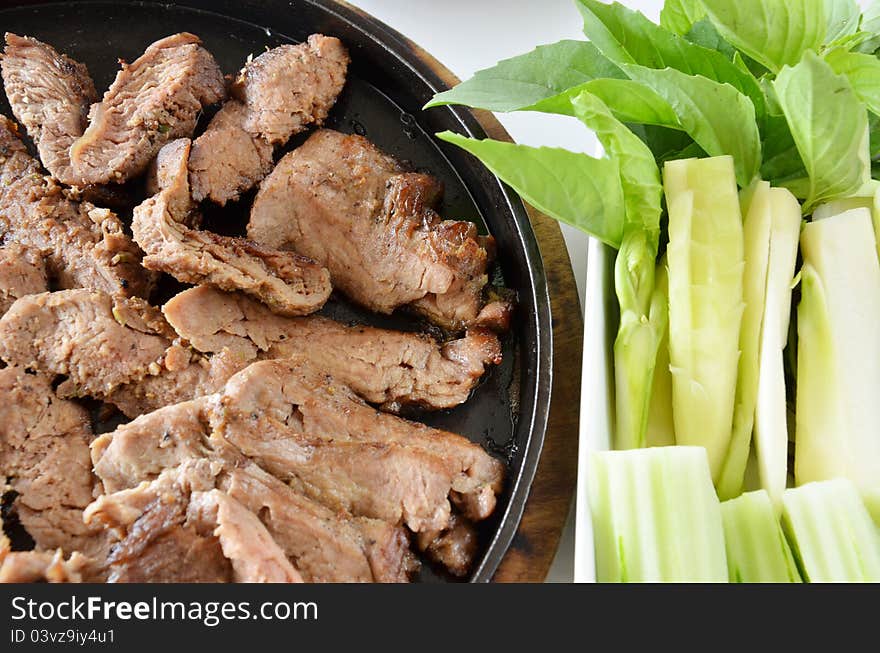 Roasted beef fillet on a hot plate ,served with vegetable