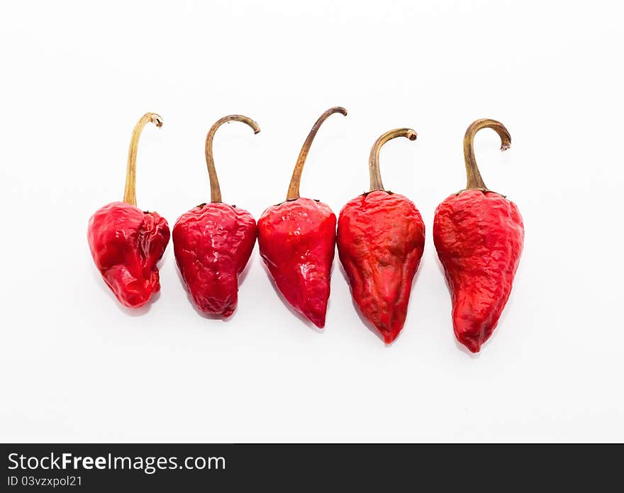 Red hot chilli peppers on white background