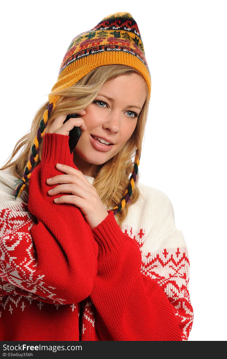 Young Woman wearing winter attire on the cell phone isolated on a white background. Young Woman wearing winter attire on the cell phone isolated on a white background