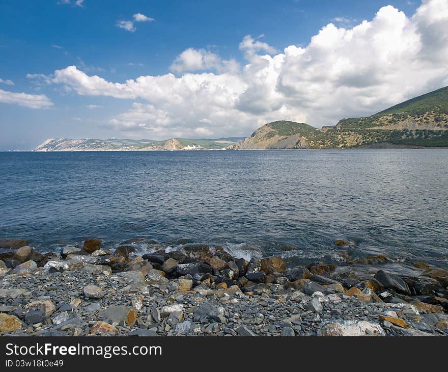 Summer landscape with sea rocks skies and clouds. Summer landscape with sea rocks skies and clouds