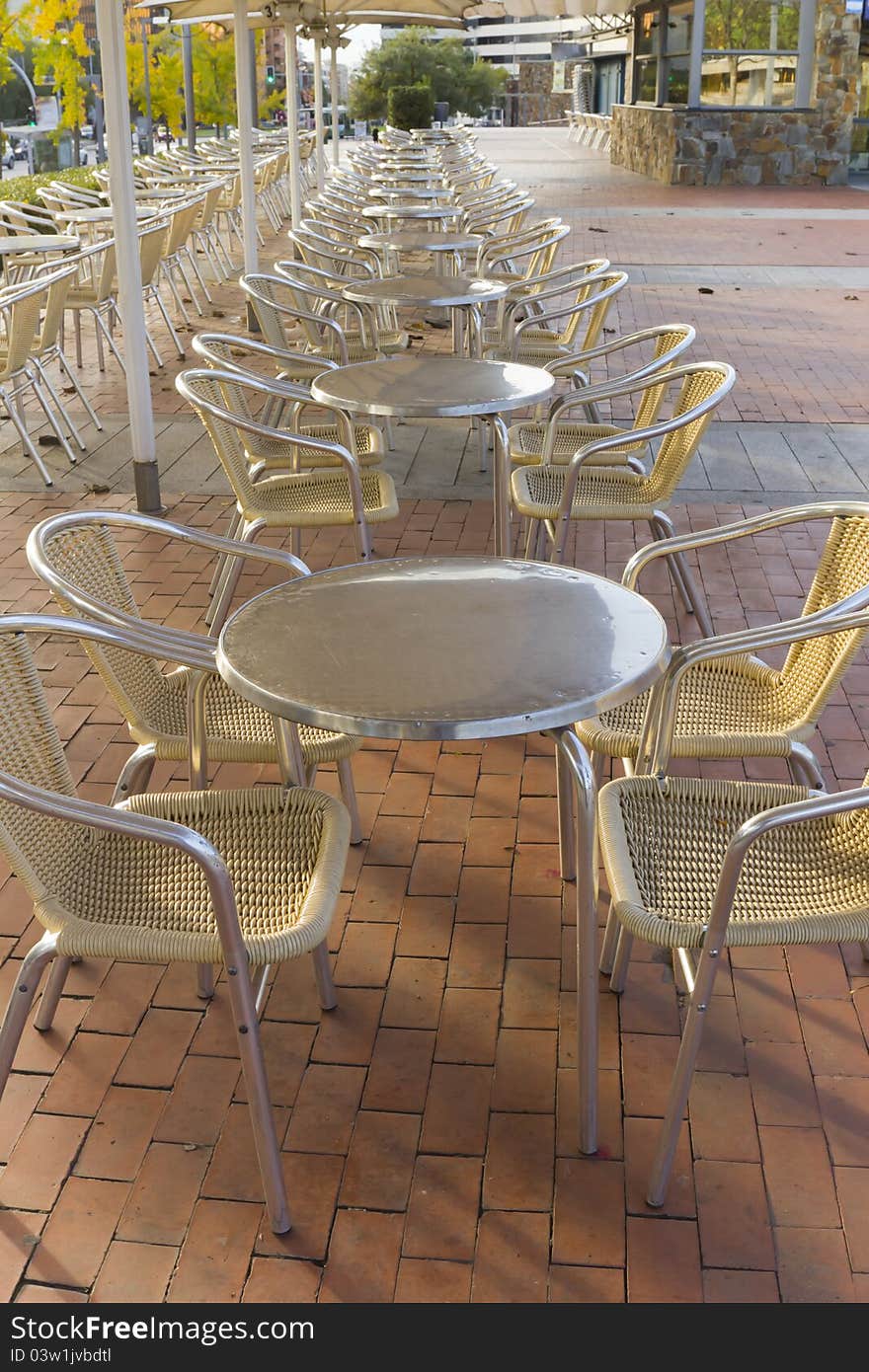 View of tables and chairs in a terrace of a bar