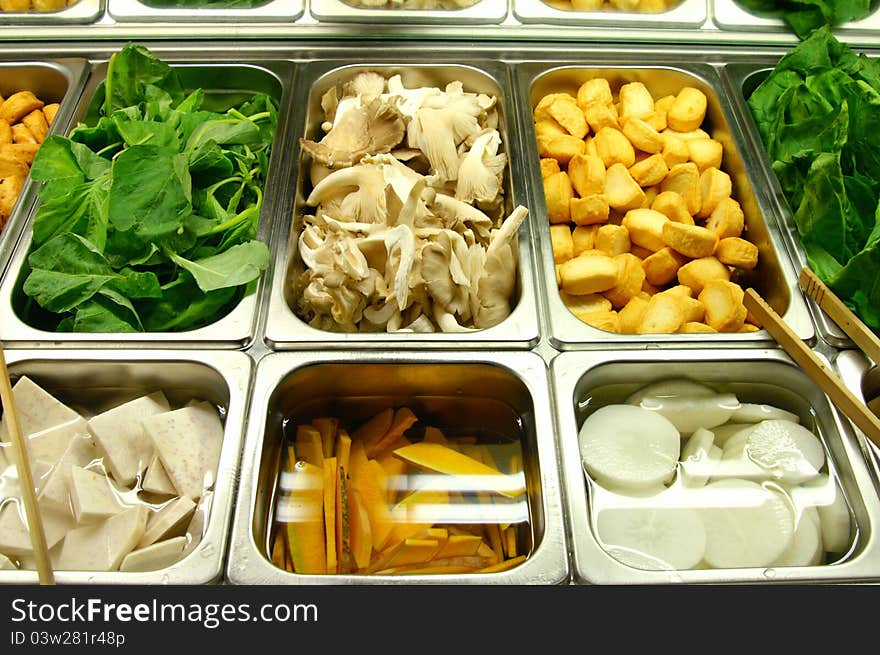 Various types of vegetables put in trays at salad bar in famous restaurant. Various types of vegetables put in trays at salad bar in famous restaurant.