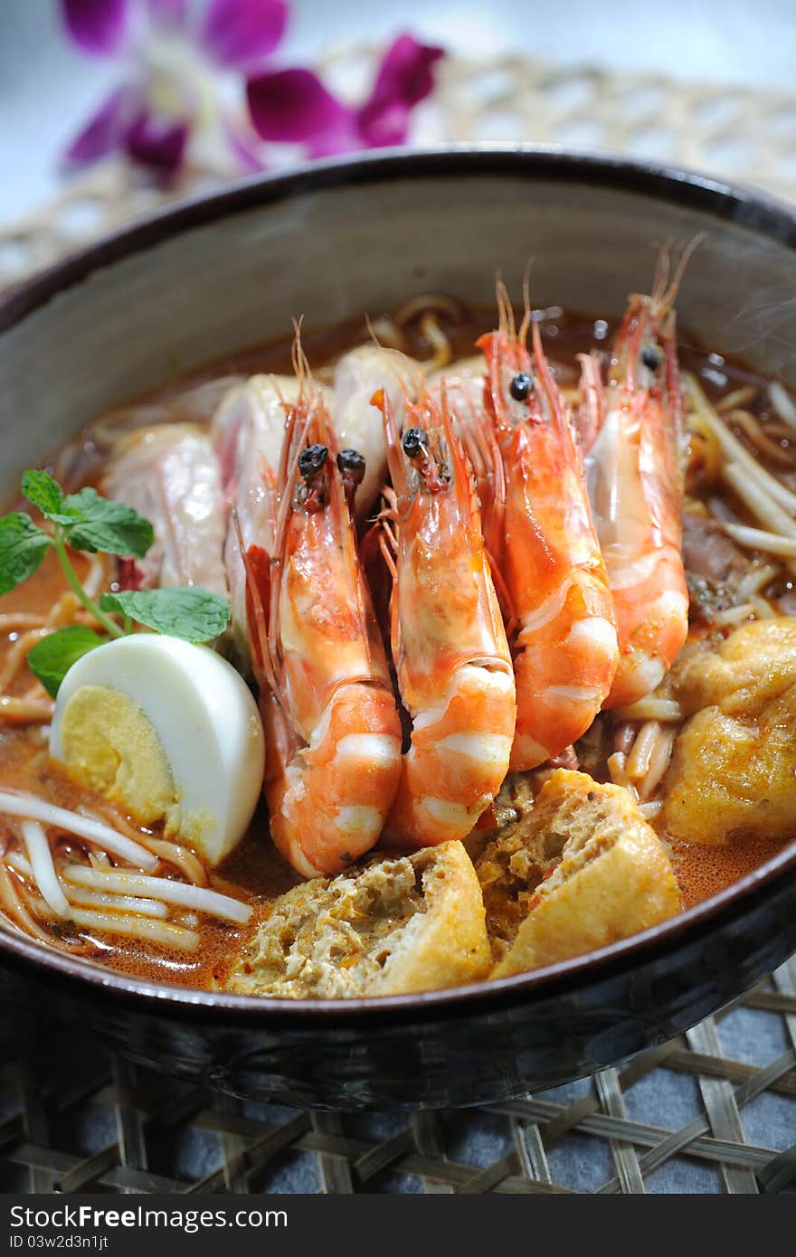 Curry laksa noodle with herbs background. Curry laksa noodle with herbs background