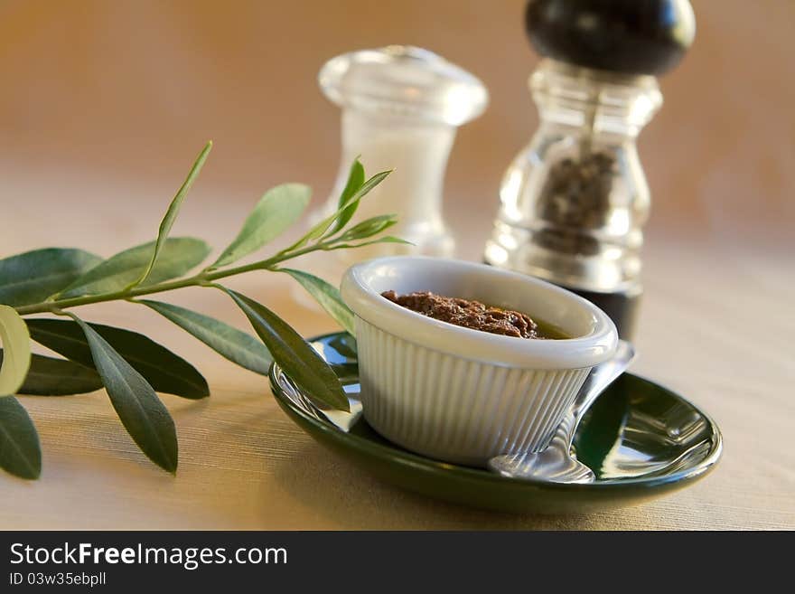 Olive Dip on small plate with leaves. Olive Dip on small plate with leaves