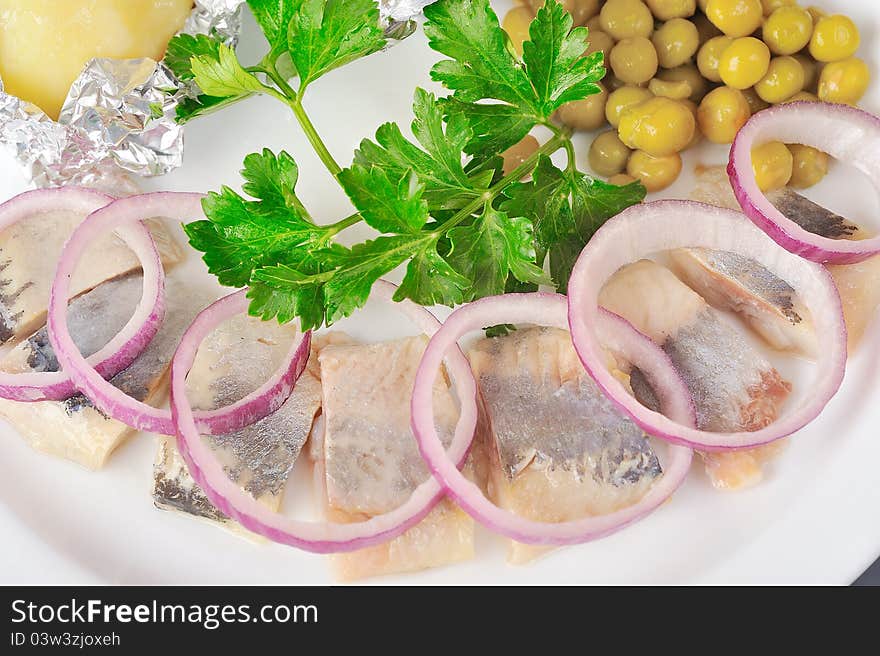 Chopped boiled vegetables with herring on plate. Chopped boiled vegetables with herring on plate