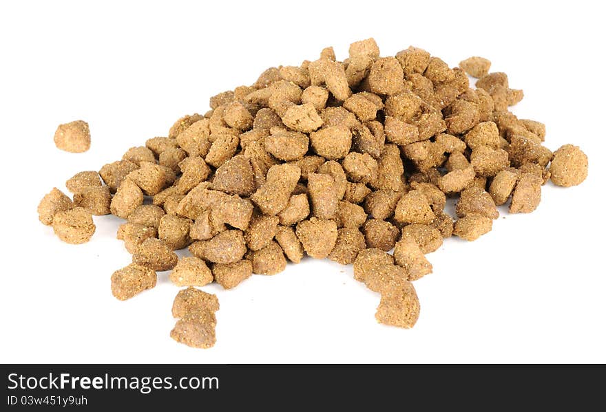 A pile of dry cat food on a white background