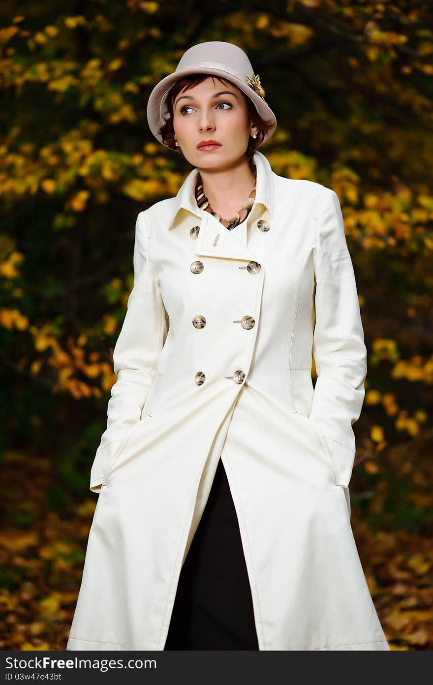 Young attractive woman walking in evening autumn park. Young attractive woman walking in evening autumn park