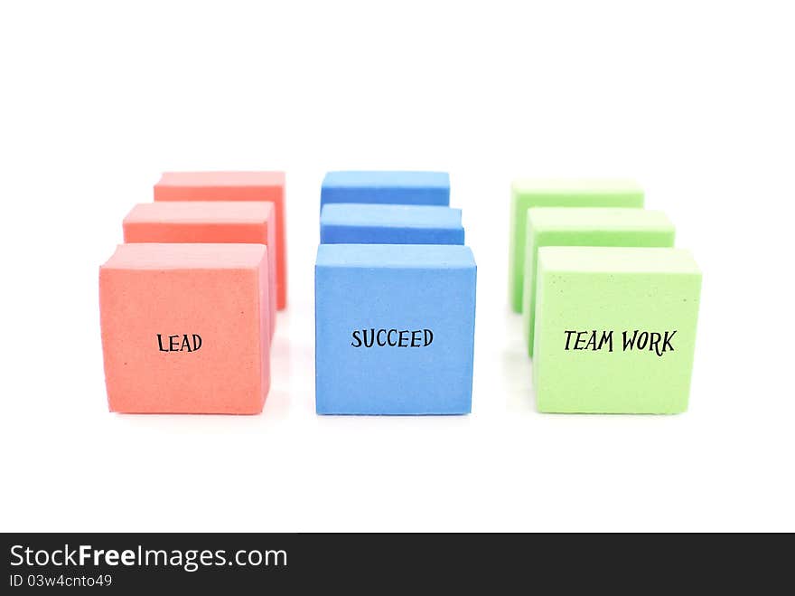 Lead, Succeed And Team Work Written On Colorful Lines Of Blocks. Lead, Succeed And Team Work Written On Colorful Lines Of Blocks