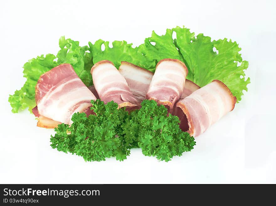 Tasty sliced bacon with parsley on white background