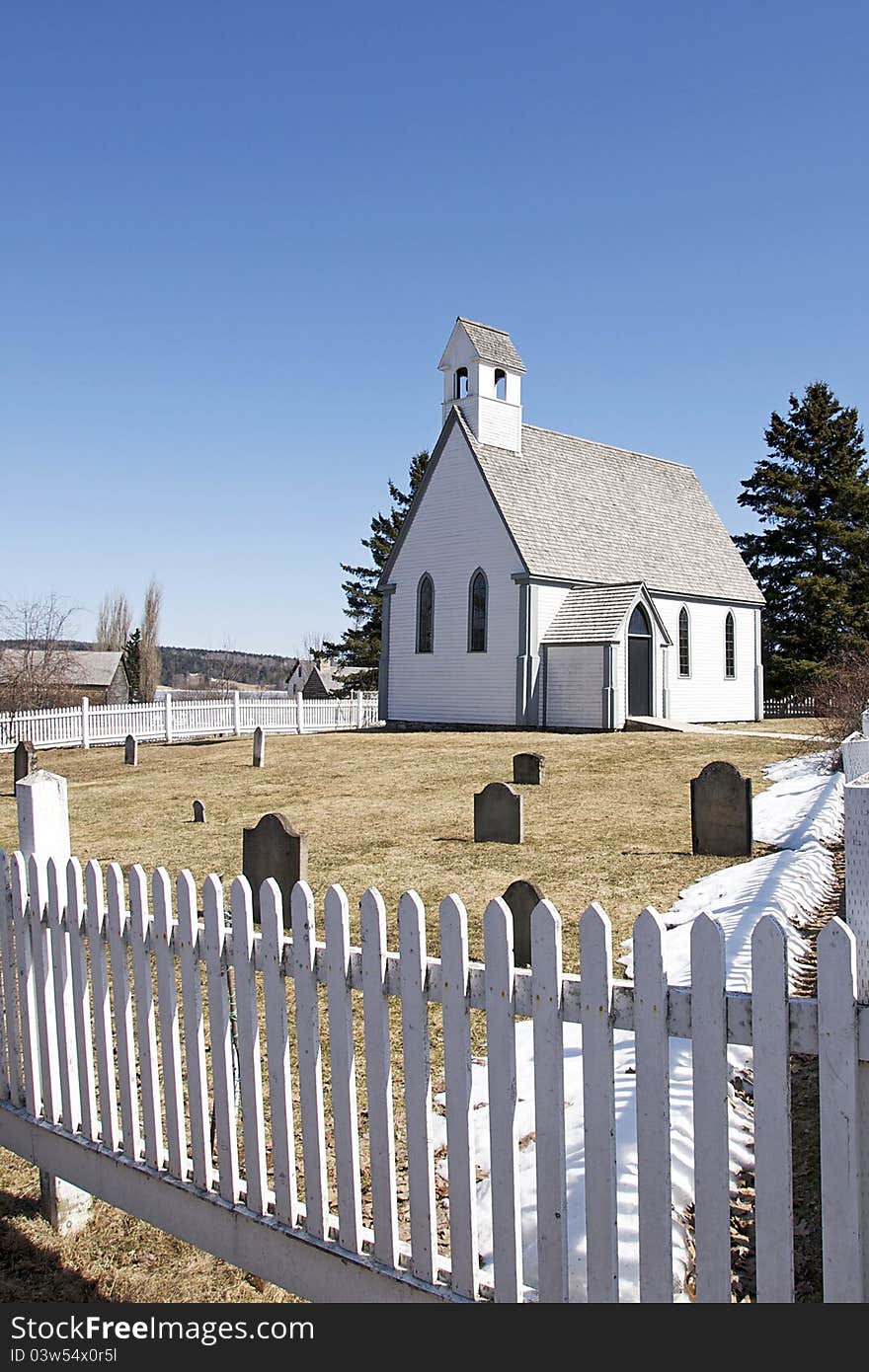 A small church and cemetery in the historic loyalist village of Kings Landing in New Brunswick, Canada. A small church and cemetery in the historic loyalist village of Kings Landing in New Brunswick, Canada