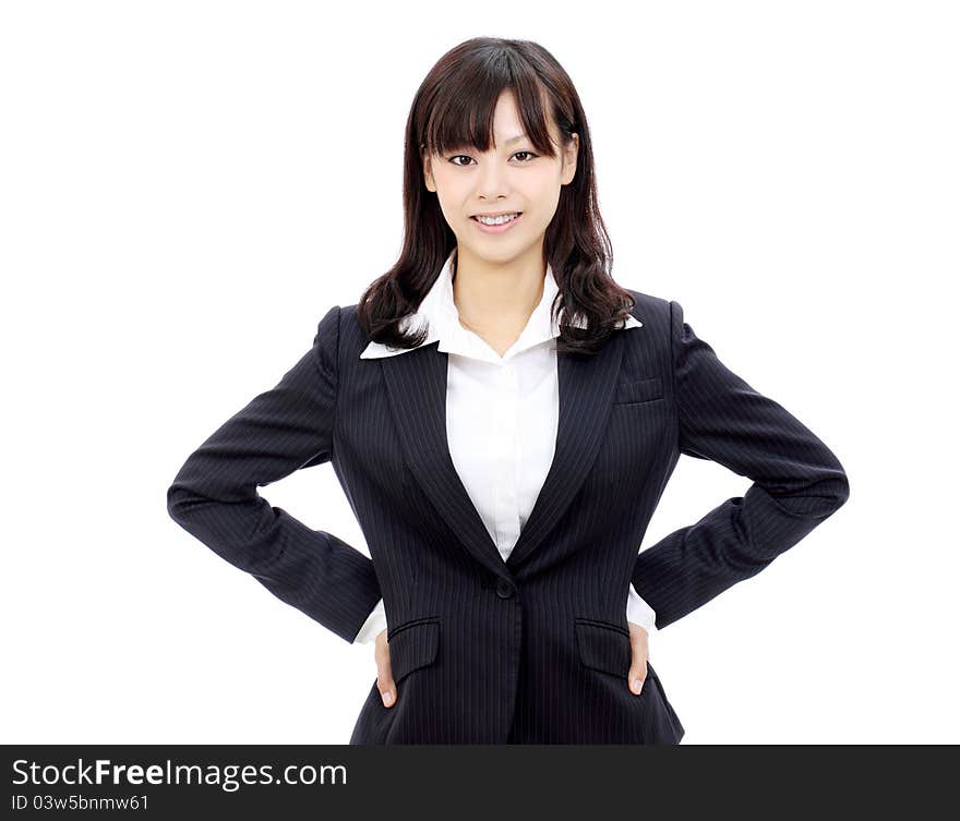 Young asian businesswoman standing with hands on hips