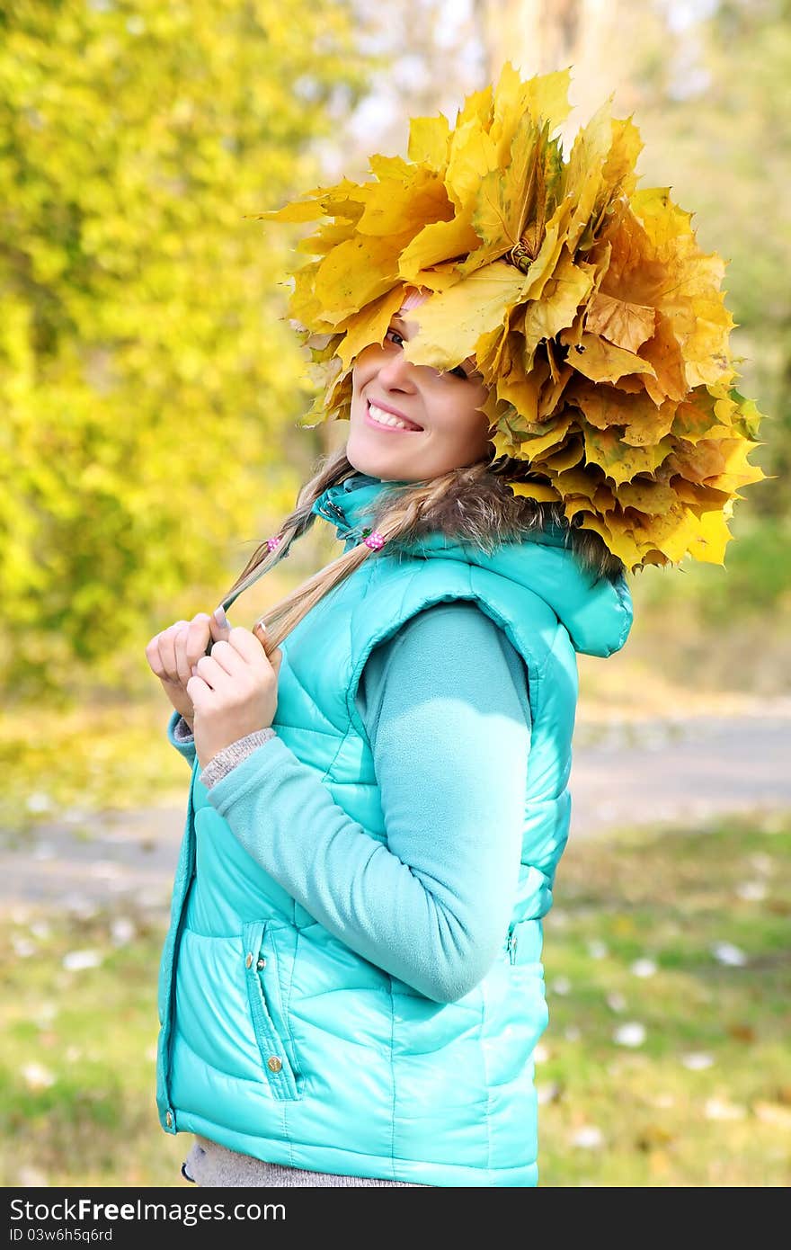 Beautiful woman wearing a crown of leaves. Beautiful woman wearing a crown of leaves