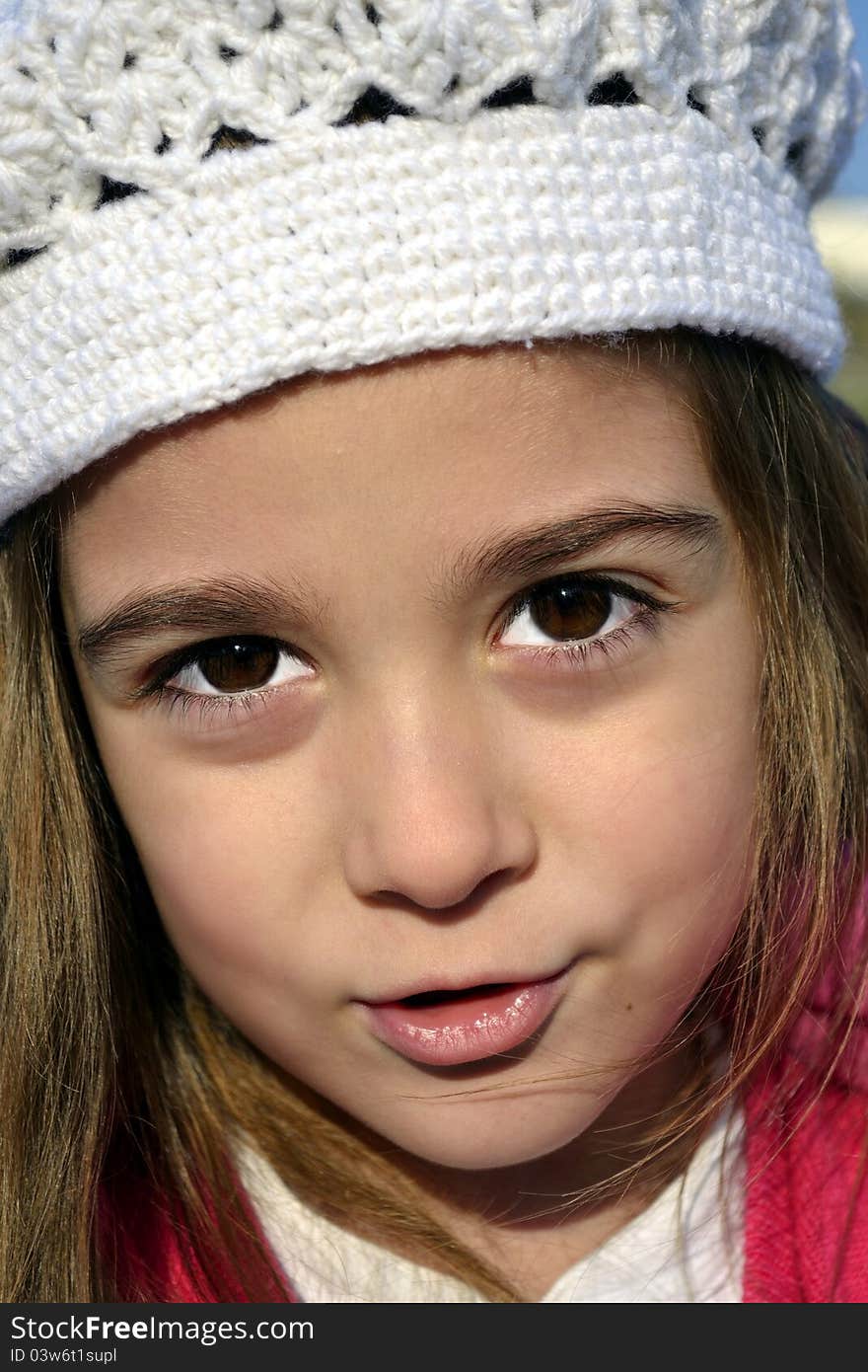 Little girl with white cap