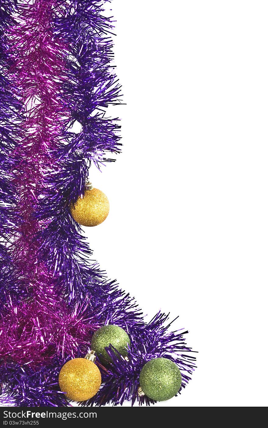 The composition of tinsel and christmas toys on a white background. The composition of tinsel and christmas toys on a white background.