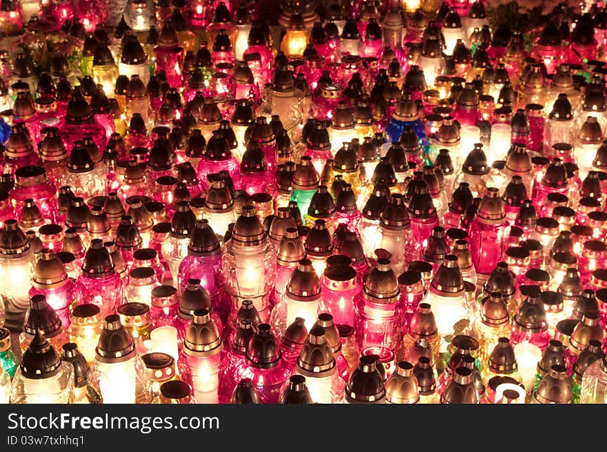 Candles arranged on the ground in the feast of all saints.