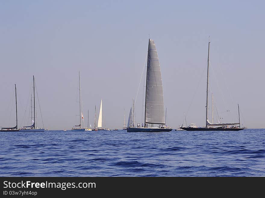 Sailboats waiting for starting regatta