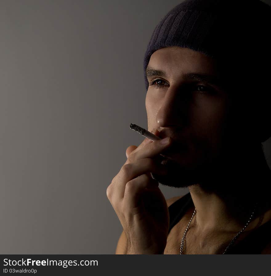 Portrait of a young man with a cigarette