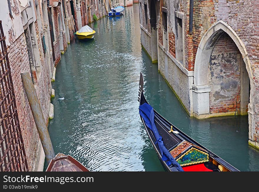 Gondola and boat on venice narrow channel. Gondola and boat on venice narrow channel