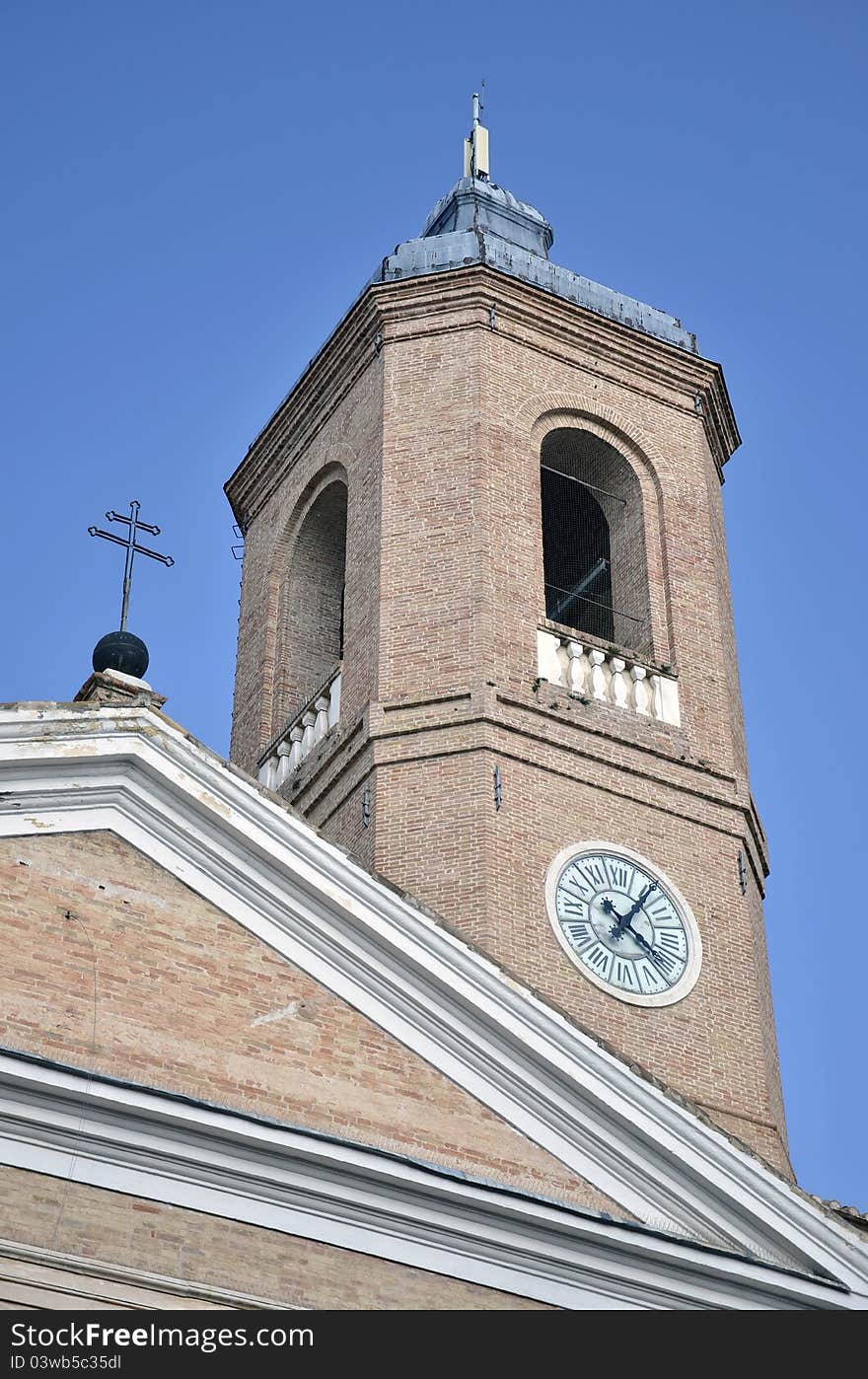 Tower with clock and cross in Camerino city at 200 km north far from Rome. Tower with clock and cross in Camerino city at 200 km north far from Rome