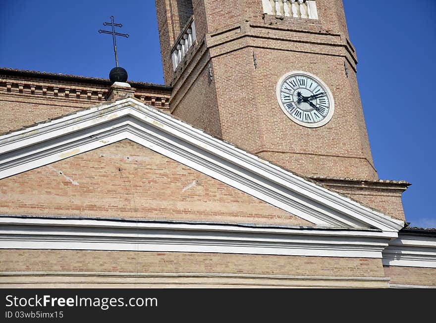 Tower with clock and cross in Camerino city at 200 km north far from Rome. Tower with clock and cross in Camerino city at 200 km north far from Rome