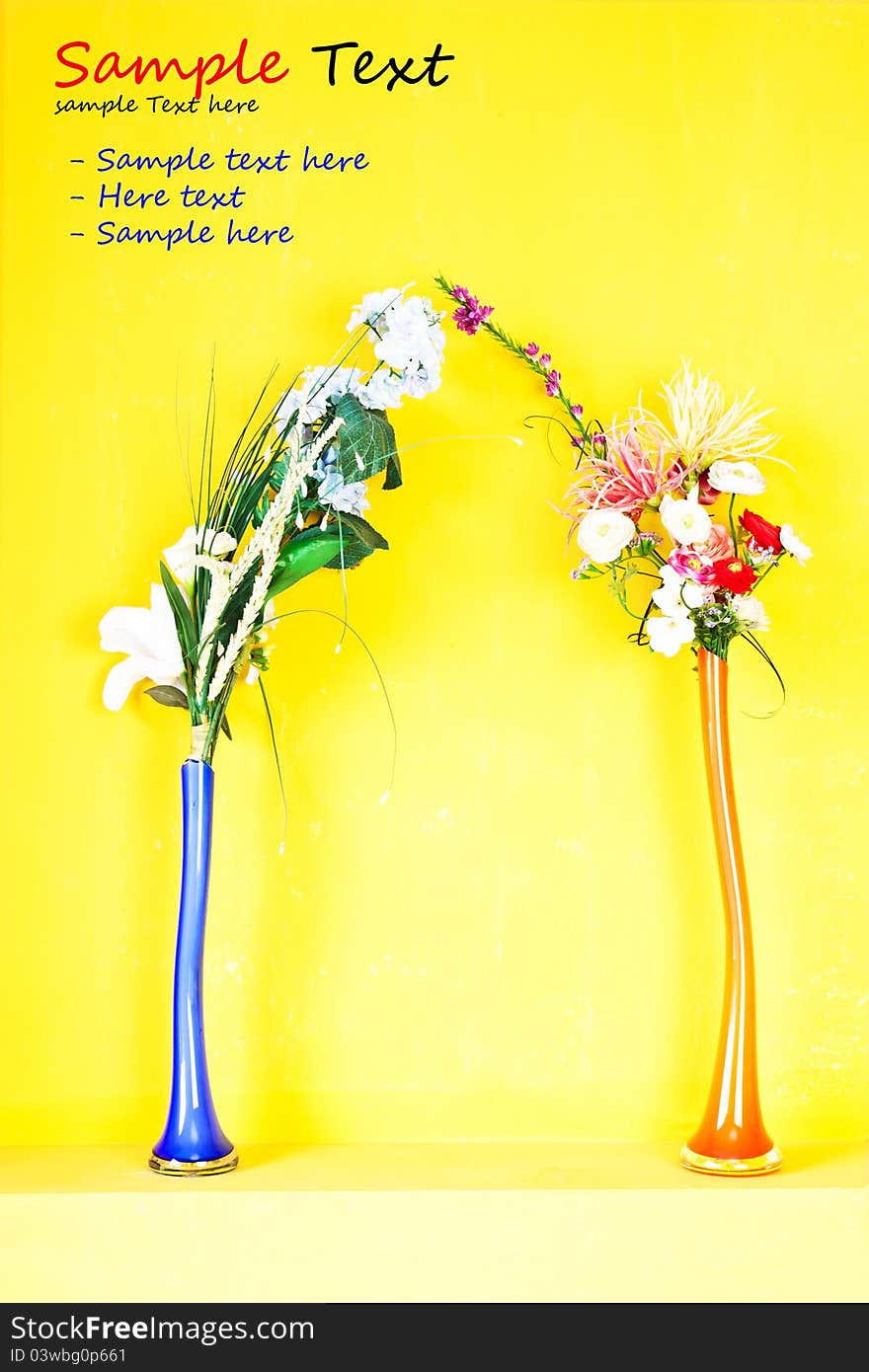 Beautiful flora in blue & orange vase on yellow background. Beautiful flora in blue & orange vase on yellow background