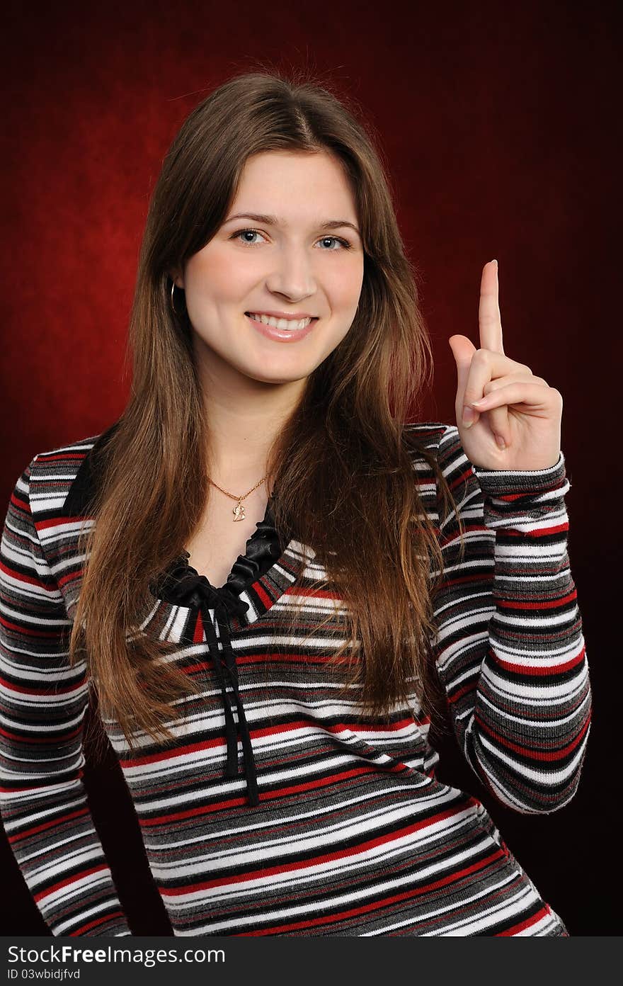 Portrait of the woman  representing something  on a red background