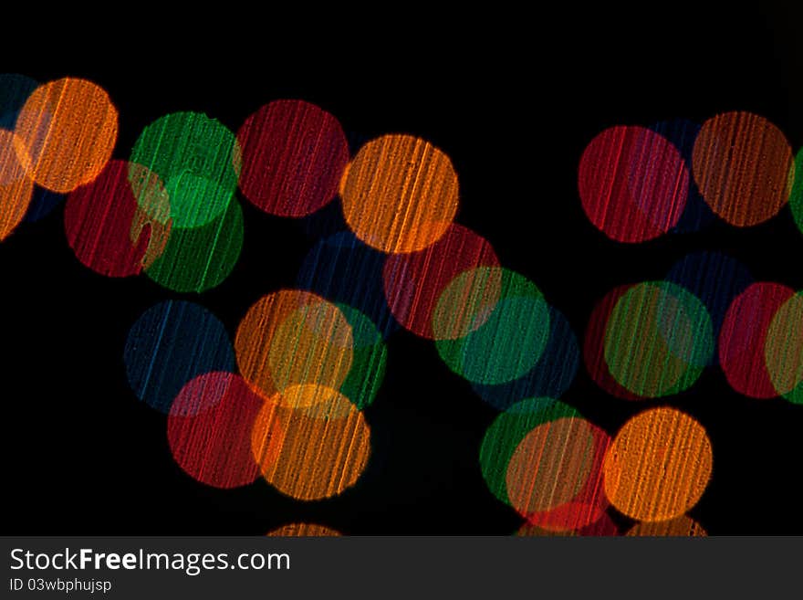 Color Bokeh against a dark background.