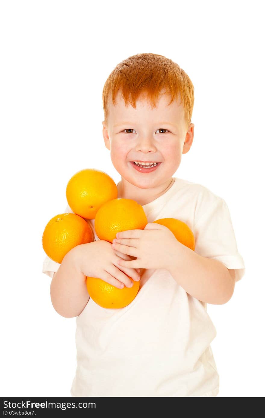 Red-haired boy with oranges isolated on white background