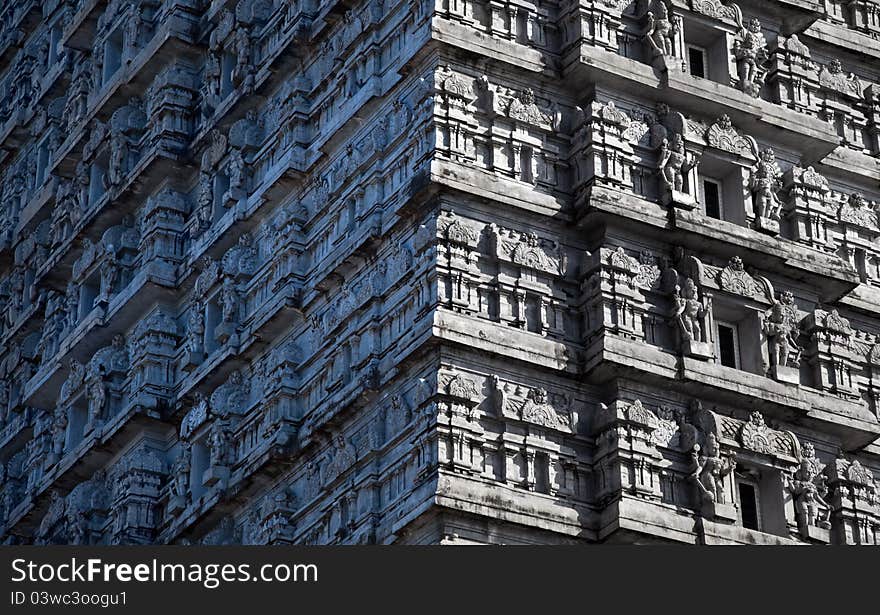 Detail of South Indian temple architecture -Gopuram or Gopura, is a monumental tower, usually ornate, at the entrance of any temple, especially in Southern India South Indian temple architecture. Detail of South Indian temple architecture -Gopuram or Gopura, is a monumental tower, usually ornate, at the entrance of any temple, especially in Southern India South Indian temple architecture