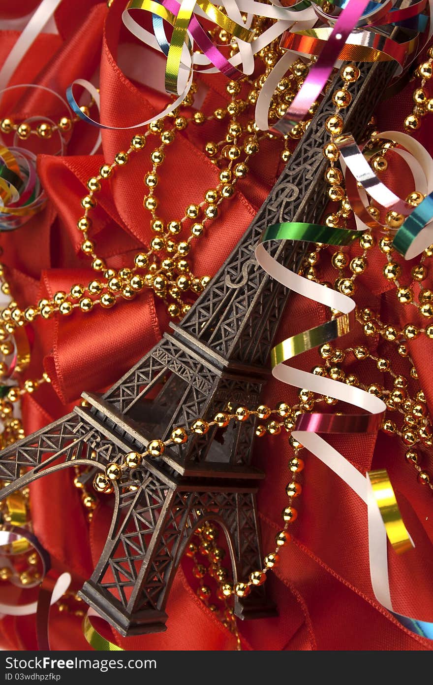 Christmas card with Tour d'Eiffel on a red ribbon