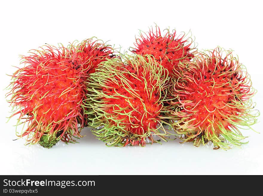 Single rambutan on white background