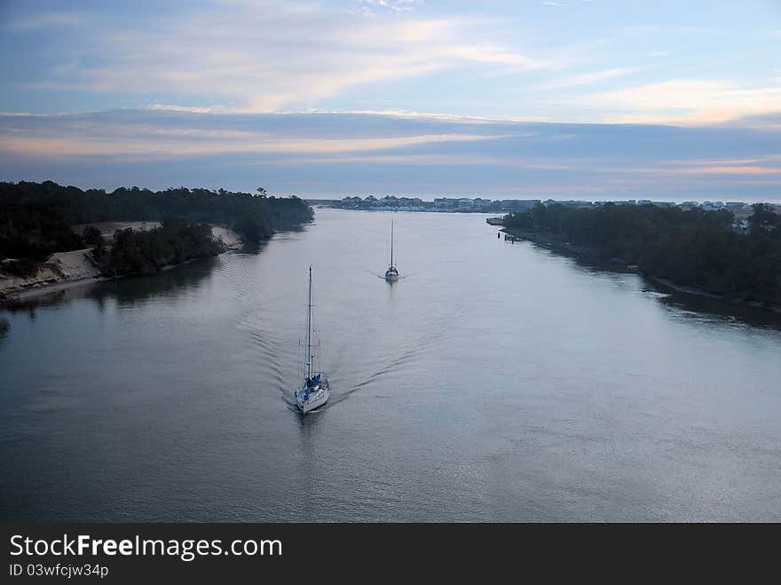 Two ships heading out for the day along the intercoastal waterway. Two ships heading out for the day along the intercoastal waterway