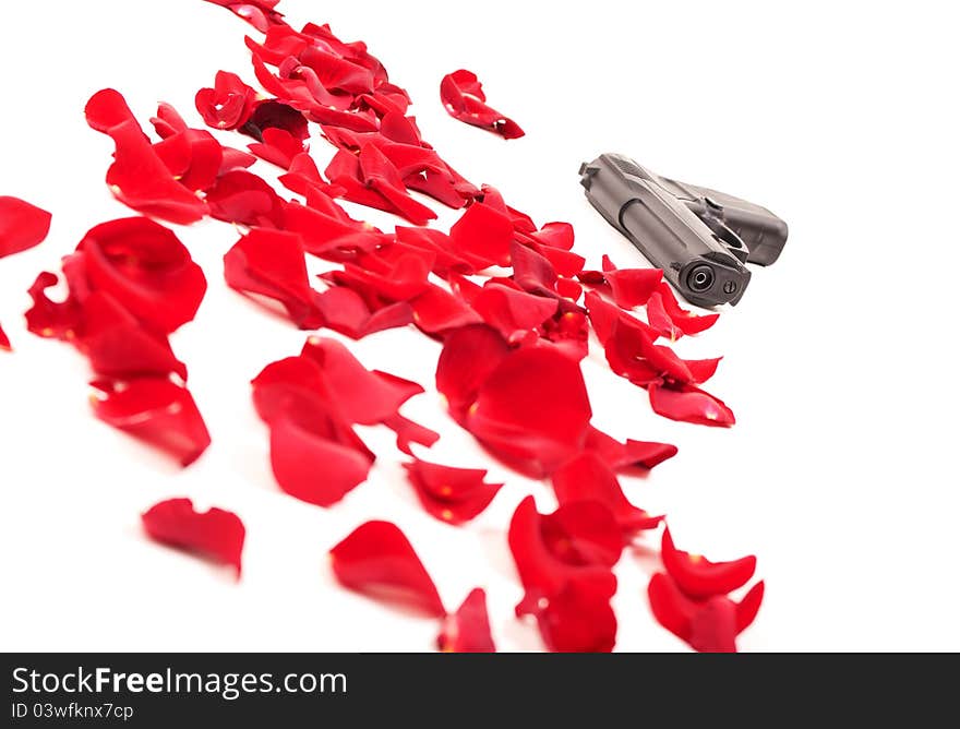 Gun between the rose petals