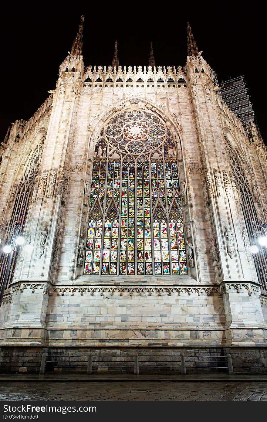 Illuminated stained glass windows after they've been recently renewed in main gothic cathedral in Milan. Illuminated stained glass windows after they've been recently renewed in main gothic cathedral in Milan