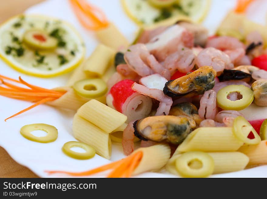 A plate of pasta and seafood. A plate of pasta and seafood