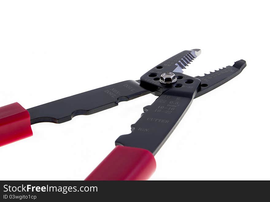 Red scissors for wires isolated on white background