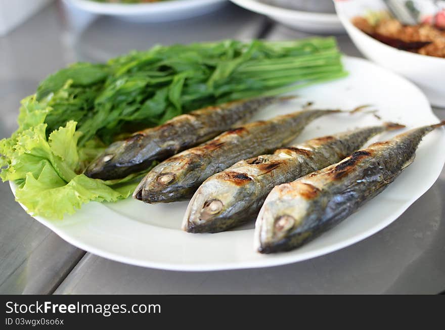 Fried sardine on plate in Asian restaurant