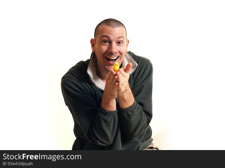 Man holds chick - symbol of Easter and new life