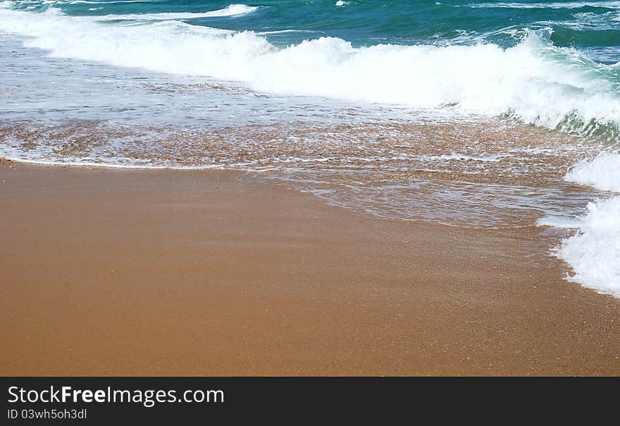 Waves running on sandy coast of Mediterranean sea. Waves running on sandy coast of Mediterranean sea