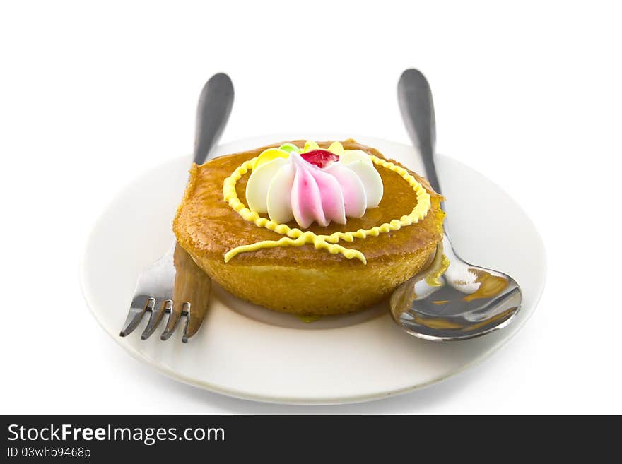 Cup cake and fork on white background