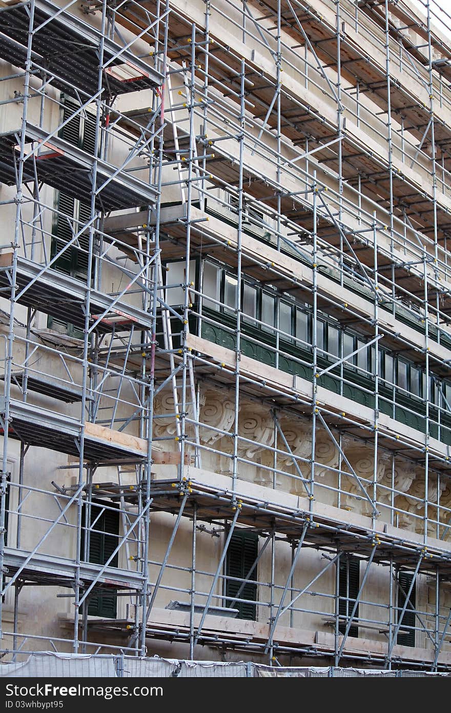 Maltese building under renovation with scaffolding