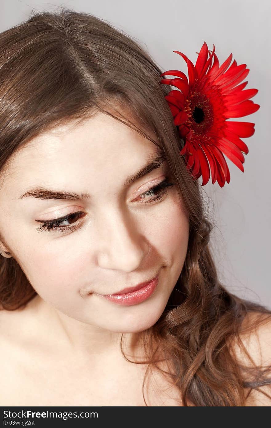 Young woman with flower in hair