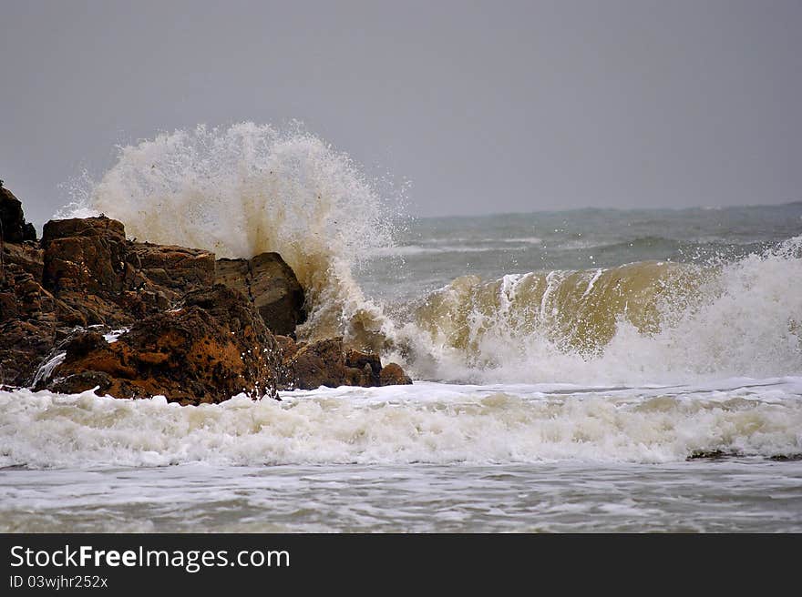 Storm on the rainy day. Waves lifting sand from the bottom. Storm on the rainy day. Waves lifting sand from the bottom.