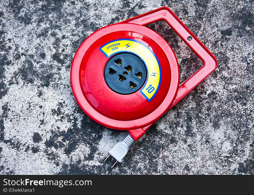 Cartridge roll of wire. Placed on a cement floor.