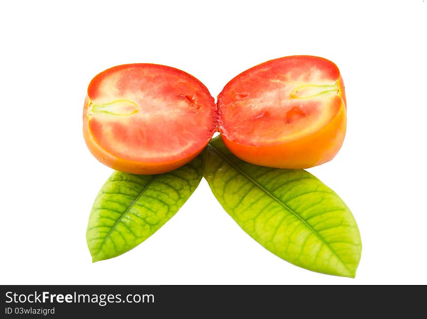 Tomato on beautiful green leaf. Tomato on beautiful green leaf