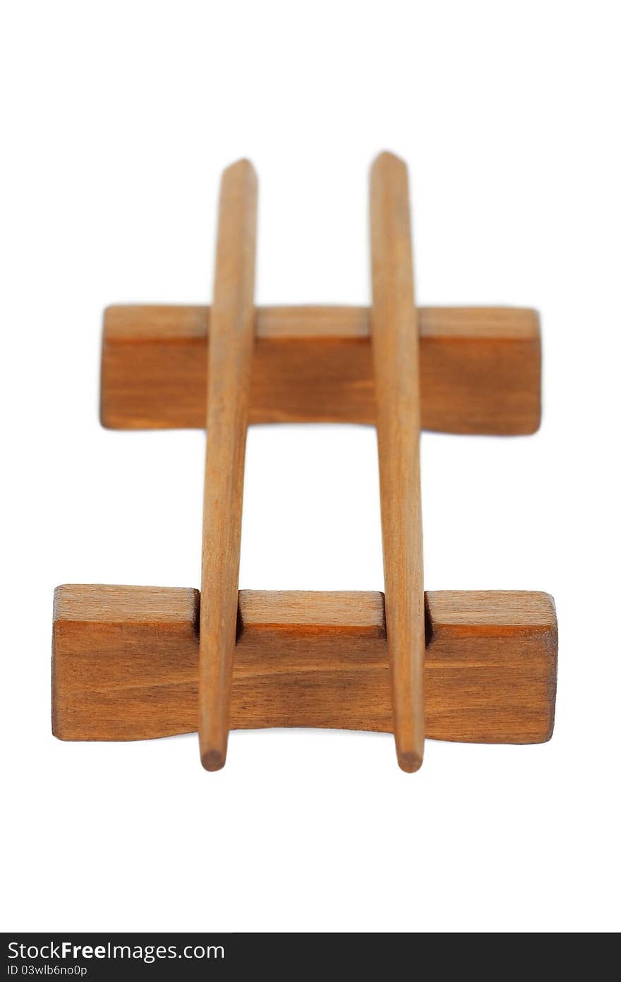 Wooden chopsticks on a stand, on a white background