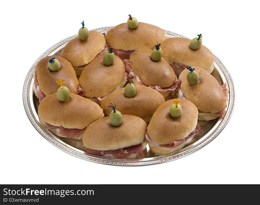 Silver oval tray with little sandwiches, isolated over white. Silver oval tray with little sandwiches, isolated over white